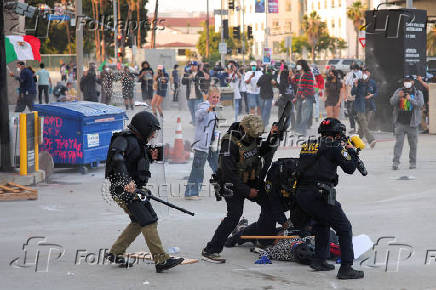 Protesters gather around the Los Angeles Federal Building after multiple detentions by ICE, in Los Angeles