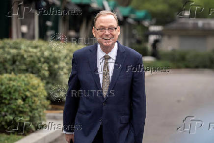 White House economic adviser Hassett walks outside the White House in Washington