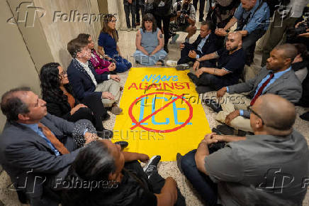 New York state lawmakers and New York City Comptroller Brad Lander conduct a sit in demonstration after being denied access to inspect the conditions of detention cells at U.S. immigration court in New York City