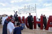 People gather to celebrate Eid wearing traditional Libyan outfits in Benghazi