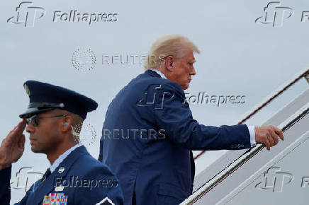 U.S. President Donald Trump boards Air Force One as he departs for New Jersey