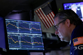 Traders work on the floor at the NYSE in New York City