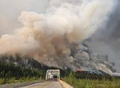 Smoke rises from the Summit Lake wildfire G90413 west of Fort Nelson