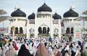 Indonesian Muslim women attend mass prayers at Baiturrahman mosque during Eid al-Adha in Banda Aceh