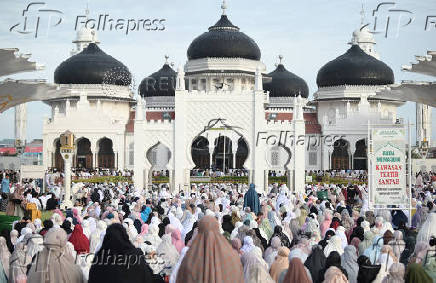 Indonesian Muslim women attend mass prayers at Baiturrahman mosque during Eid al-Adha in Banda Aceh