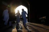 Muslims leave after offering prayers at the Jama Masjid on the occasion of Eid al-Adha, in the old quarters of Delhi