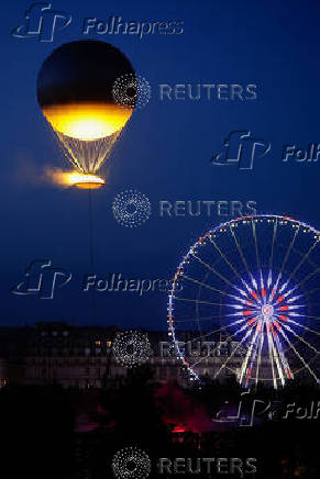 A new Paris 2024 cauldron set on a balloon is back in the Tuileries Garden and the Paris skyline
