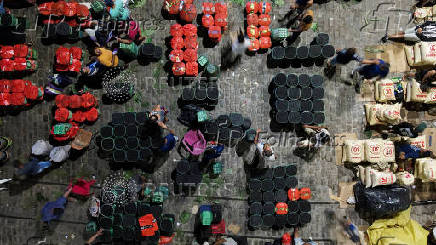 Drone views shows people gathering next to baskets filled with Amazon acai berries at the Ver-o-Peso market
