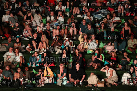 Audience watches an outdoor screening of 