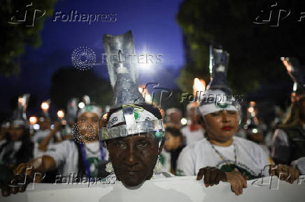 Demonstrators attend a march in defense of the living forest, territorial rights, and global climate responsibility during the U.N. Climate Change Conference (COP30) in Belem