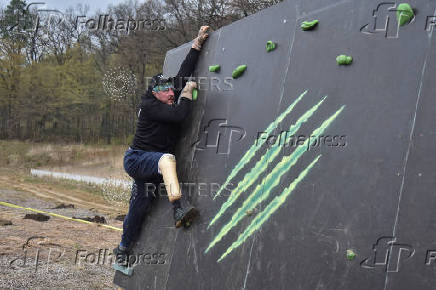 Ukrainian war veteran attends a race with obstacles in Vynnyky, ouside of Lviv