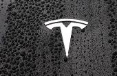 The logo of Tesla is seen on a Tesla car in Brussels
