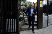 Former Sinn Fein President Gerry Adams walks outside the High Court, in Dublin