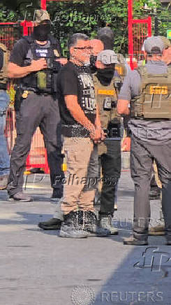 Law enforcement officers conduct a federal immigration raid in Bethlehem