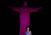 Models present creations by Alessa at the Christ the Redeemer statue to mark the launch of Rio Fashion Show, in Rio de Janeiro