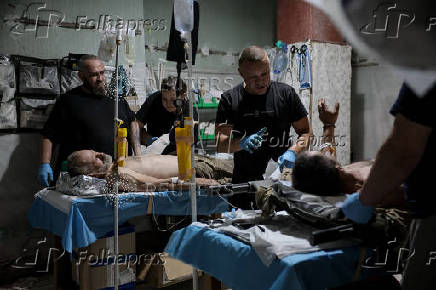 Ukrainian Armed Forces combat medics treat injured servicemen near Chasiv Yar