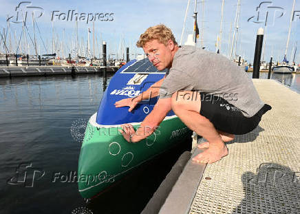 German stand-up paddler Michael Walther takes to the Baltic Sea for a test run in Kiel