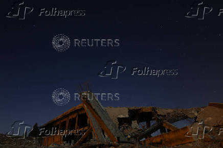 A meteor streaks across the sky, in Qamishli