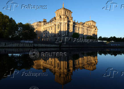 Sunlight illuminates the Reichstag building, the seat of the German parliament, in Berlin
