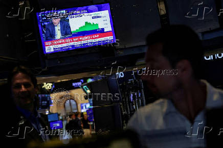 A screen displays news on 