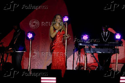 Mariah Carey performs on a floating stage shaped like a giant Victoria amazonica water lily at the Guama River in Belem