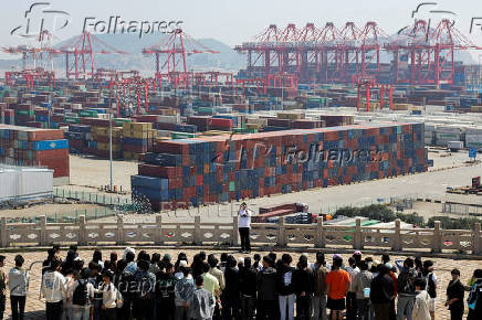 FILE PHOTO: Gantry cranes stand near shipping containers at Yangshan Port outside of Shanghai