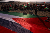Pro-Palestinian protesters demonstrate on the Zuiderstrand beach against the violence in Gaza