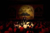 Shi'ite Muslims listen to a religious reciter during a mourning gathering marking Ashura, the holiest day on the Shi'ite Muslim calendar, in Baghdad