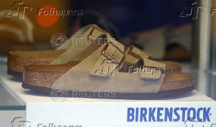 FILE PHOTO: A pair of shoes is pictured in a window of a Birkenstock footwear store in Berlin