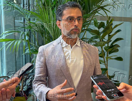United Arab Emirates' Minister of Energy Suhail Mohamed Al Mazrouei speaks with reporters in Vienna