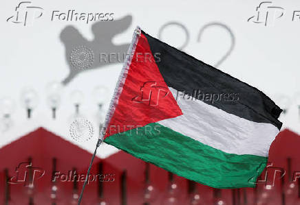 Supporters gather to call for Palestinian protest during the 82nd Venice Film Festival