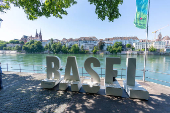 The name of Basel city is seen in letters along the banks of the Rhine river during the Eurovision Song Contest in Basel
