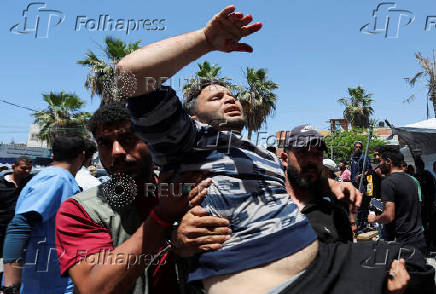 Palestinian casualties are brought into Al-Aqsa Martyrs Hospital, following an Israeli strike, in Deir al-Balah