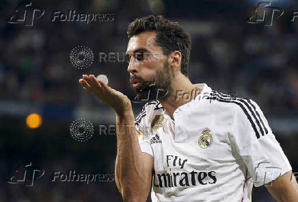FILE PHOTO: Real Madrid's Arbeloa blows a kiss as he celebrates after scoring a goal against Almeria in Madrid