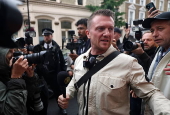 Political activist Tommy Robinson faces court over journalist harassment