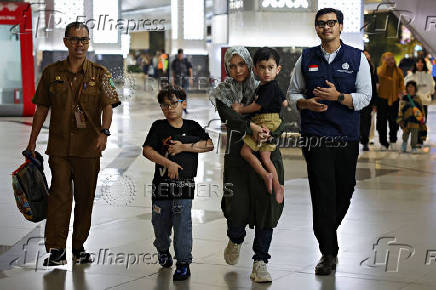 Indonesian citizens evacuated from Iran arrive at Soekarno Hatta International Airport in Tangerang