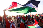 Pro-Palestinian protesters demonstrate on the Zuiderstrand beach against the violence in Gaza