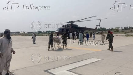 A helicopter carrying casualities lands at Nangarhar airport, in Jalalabad