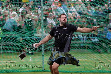 A competitor takes part in the Heavies event during the Braemar Royal Highland Gathering at the Princess Royal and Duke of Fife Memorial Park in Braemar, Scotland