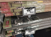 Shelfs made by the German company DOLLE Shelving hang for sale at a Home Depot store in New York City