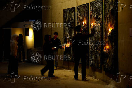 Visitors interact with an artwork installation at the