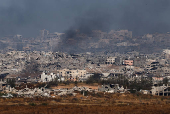 Smoke rises from northern Gaza, as seen from the Israeli side of the Israel-Gaza border