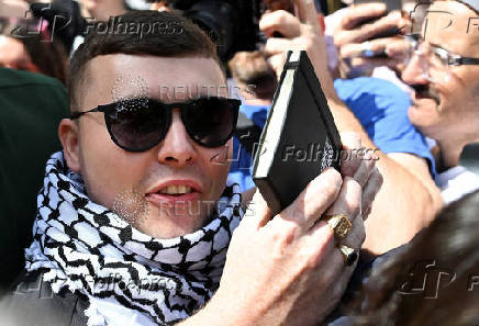 Member of Irish rap group Kneecap in UK court on terrorism charge