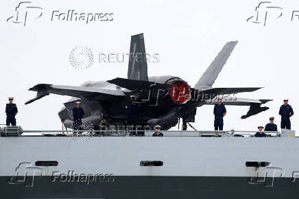 Britain's HMS Prince of Wales aircraft carrier arrives at Marina Bay Cruise Centre in Singapore