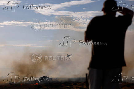A wildfire burns on the outskirts of Valmojado