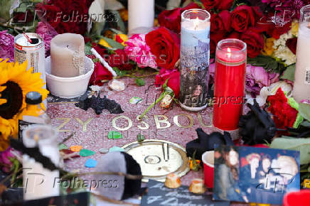 Flowers and pictures are placed on the star of late Ozzy Osbourne at the Hollywood Walk of Fame in Los Angeles