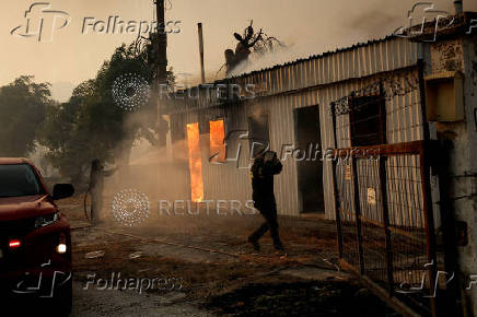 Wildfire burns houses, factories, forcing evacuations near Patras