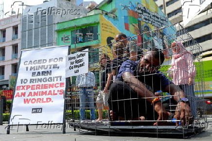 PETA offers 10 MYR (Malaysia Ringgit) or 02 Euro to be caged like an animal for one minute in launch of worldwide campaign in Kuala Lumpur