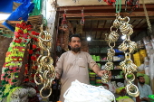 Roadside shop sells ornaments ahead of Eid al-Adha in Peshawar
