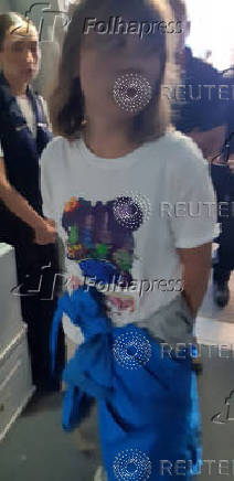 Greta Thunberg walks in a plane in a location given as Tel Aviv